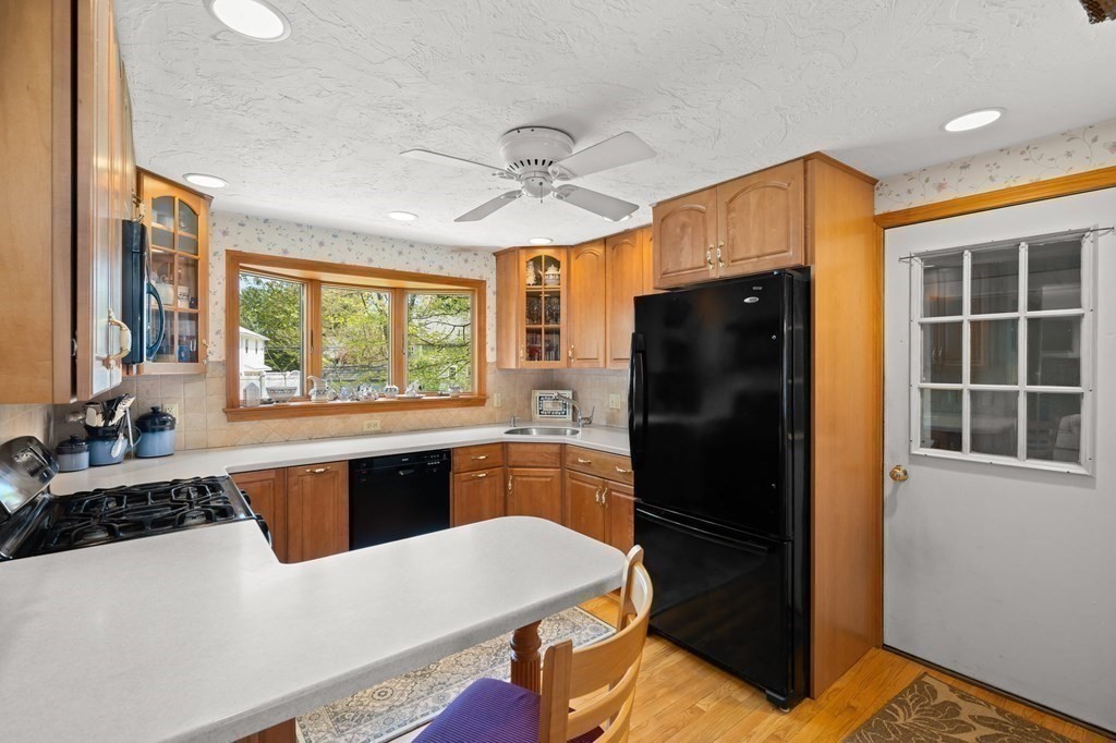 23 Indian Path Dedham, MA 02026 - Photo 14 of 35 a kitchen with a refrigerator and a sink
