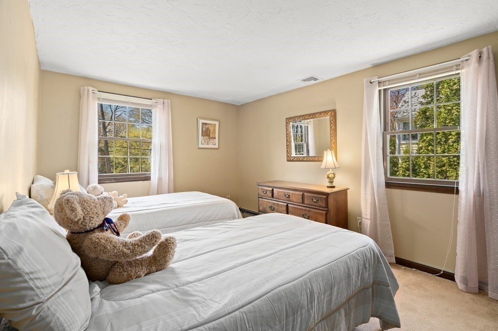 23 Indian Path Dedham, MA 02026 - Photo 19 of 35 a bedroom with a bed and window