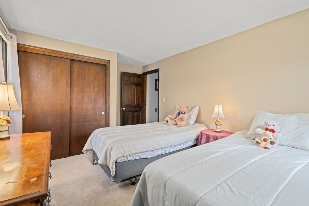 23 Indian Path Dedham, MA 02026 - Photo 20 of 35 a bedroom with two beds and a closet