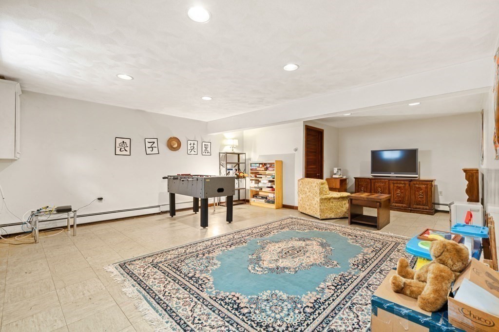 23 Indian Path Dedham, MA 02026 - Photo 26 of 35 a living room with furniture and a table