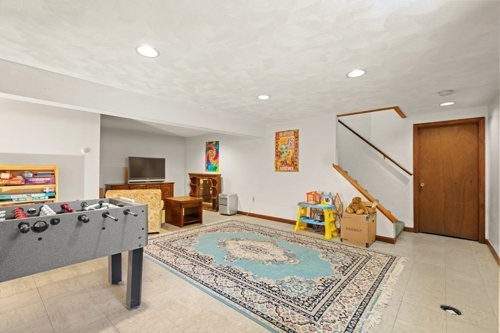 23 Indian Path Dedham, MA 02026 - Photo 27 of 35 a bed room with furniture and a flat screen tv