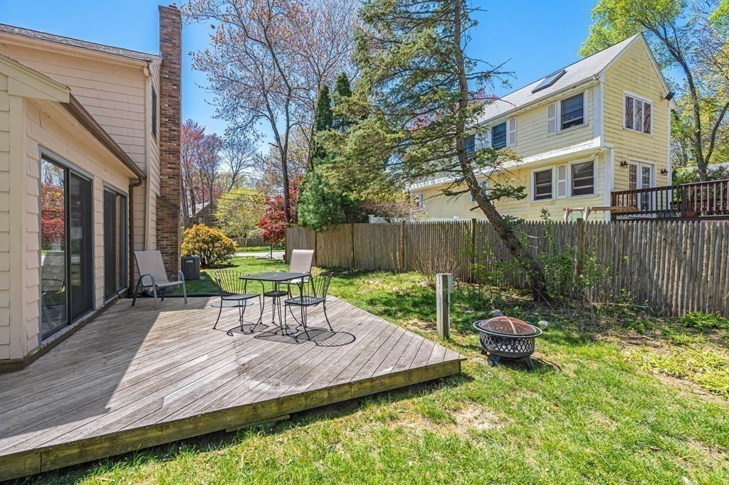 23 Indian Path Dedham, MA 02026 - Photo 33 of 35 a view of a chair and table in backyard of the house