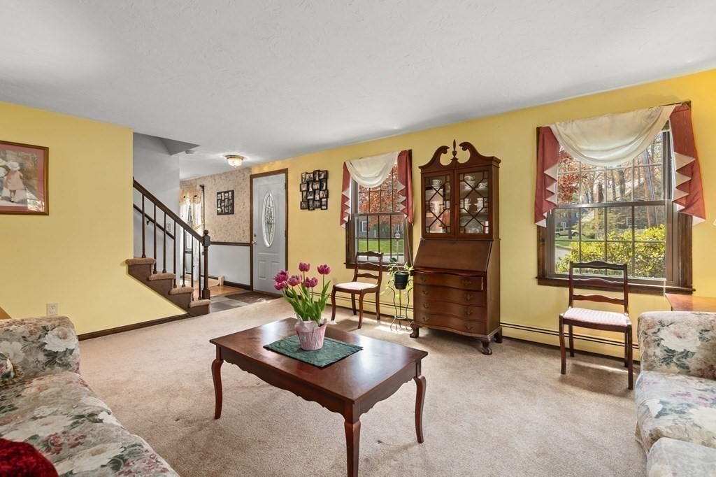 23 Indian Path Dedham, MA 02026 - Photo 5 of 35 a living room with furniture and wooden floor