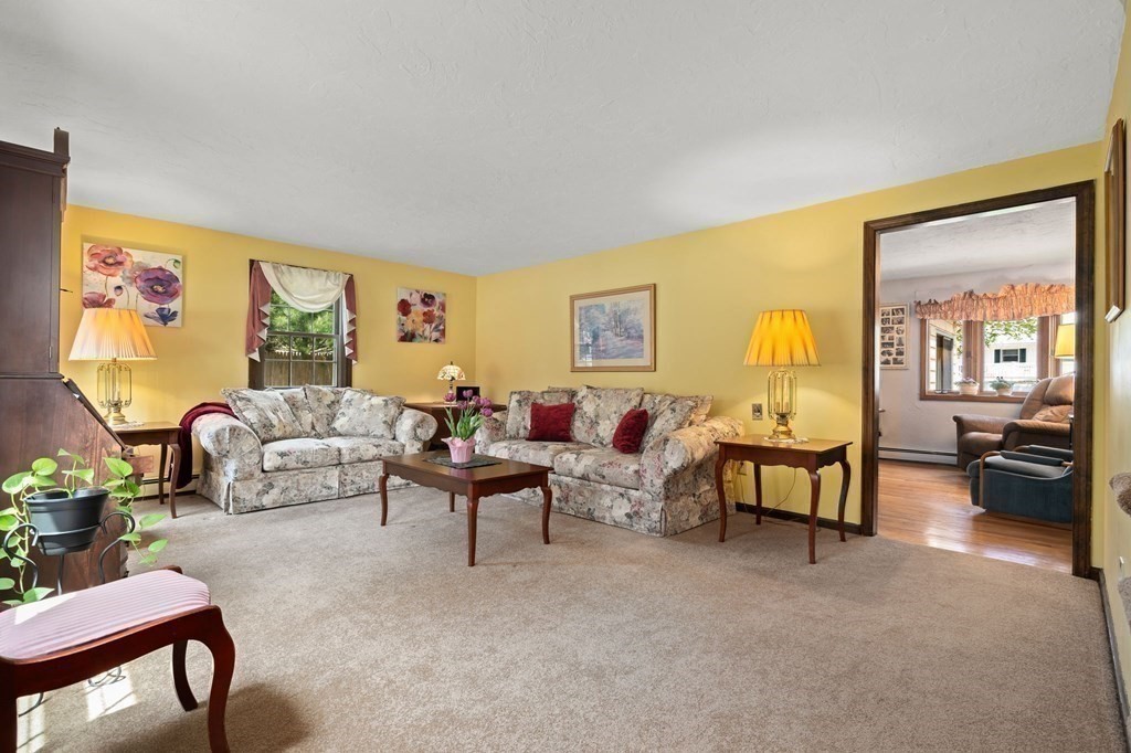 23 Indian Path Dedham, MA 02026 - Photo 6 of 35 a living room with furniture and a large window