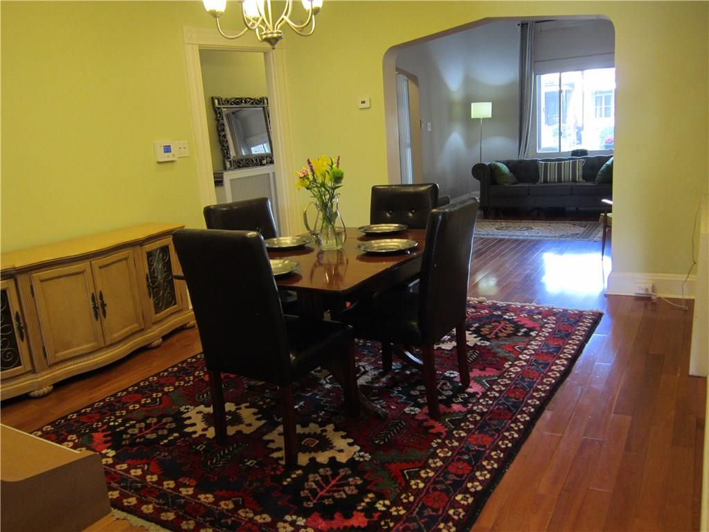 214 South Mathilda Street Friendship Park, PA 15224 - Photo 7 of 25 Dining room and another view of the living room and entry hall.