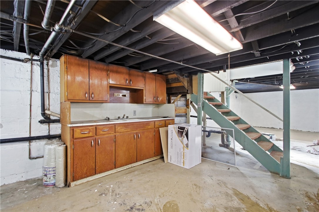 1925 Sunset Avenue Springfield, OH 45505 - Photo 33 of 45 This spacious unfinished basement offers a versatile layout and abundant storage potential.
