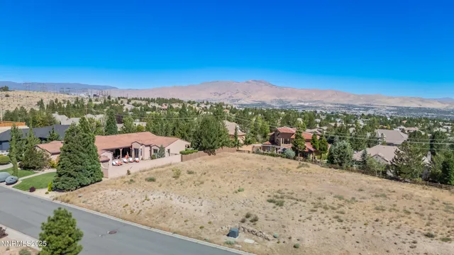a view of a terrace with a garden and mountain view