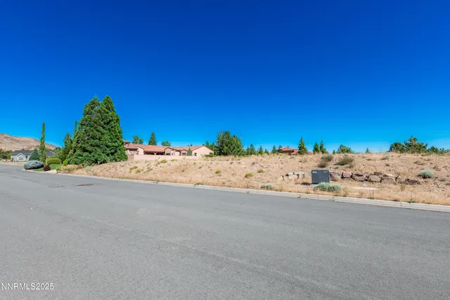 a view of a road and a building in the background