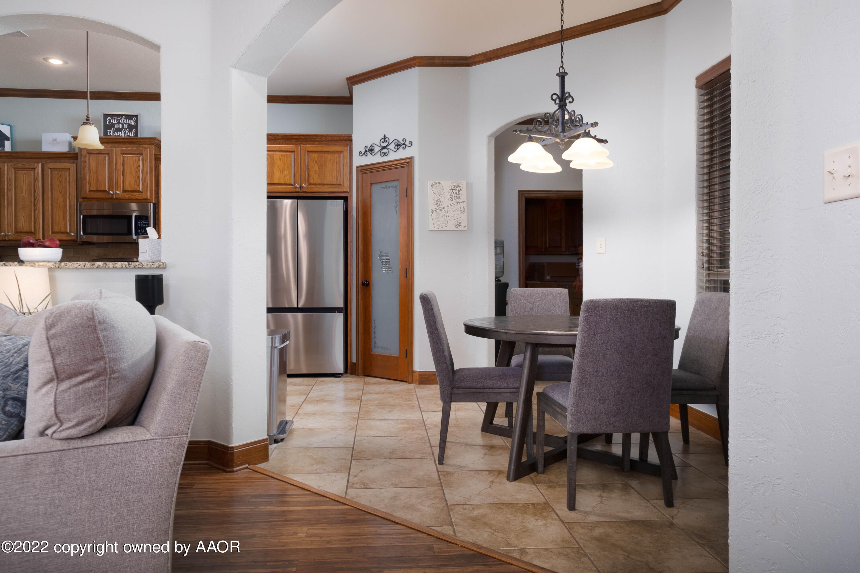 8417 Hamilton Drive Amarillo, TX 79119 - Photo 11 of 42 a view of a dining room with furniture and a chandelier