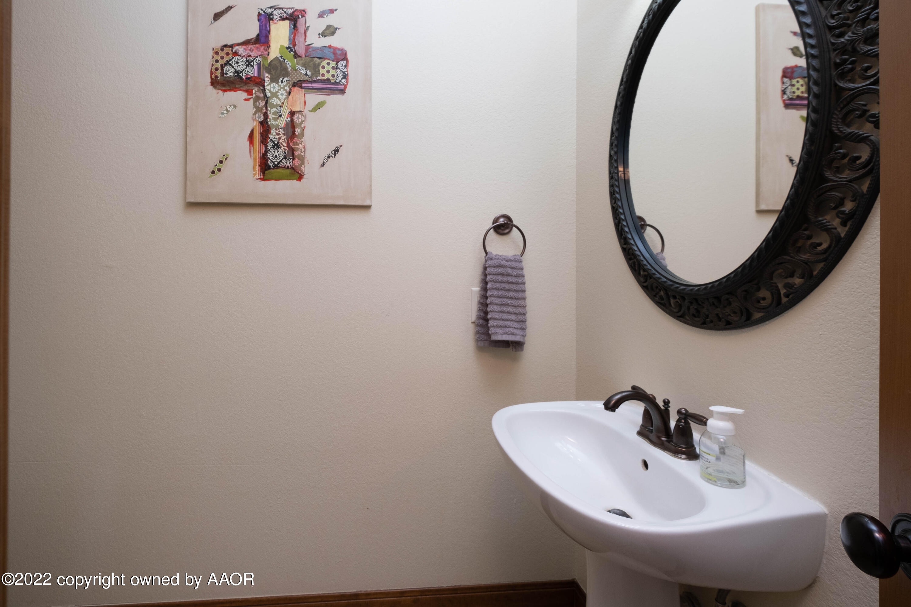 8417 Hamilton Drive Amarillo, TX 79119 - Photo 15 of 42 a bathroom with a sink and a mirror