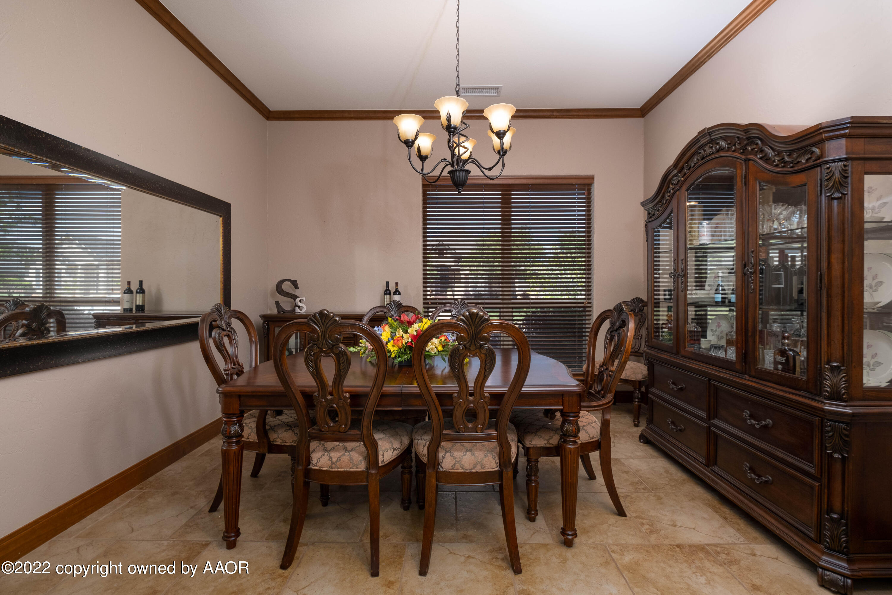 8417 Hamilton Drive Amarillo, TX 79119 - Photo 16 of 42 a view of a dining room with furniture and chandelier
