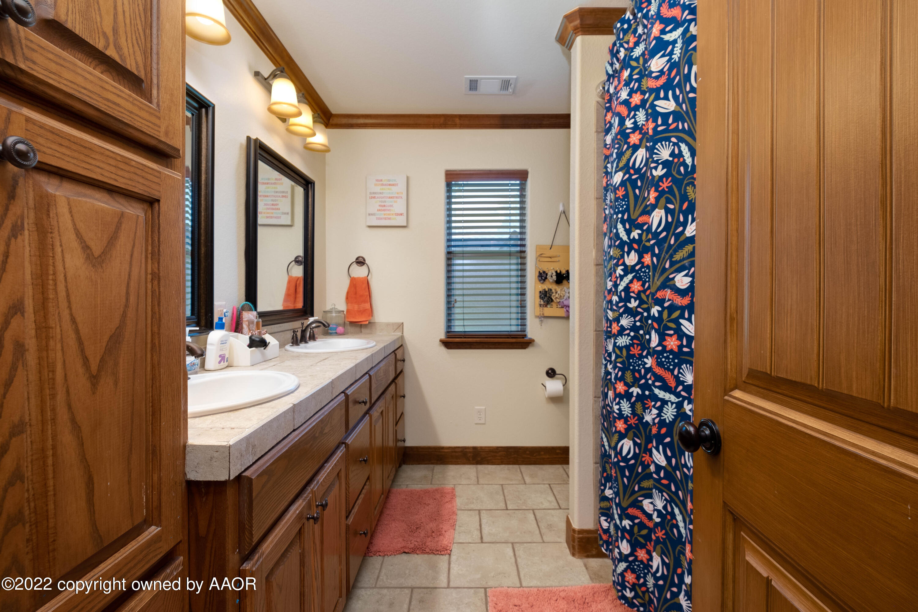 8417 Hamilton Drive Amarillo, TX 79119 - Photo 19 of 42 a bathroom with a sink and a mirror