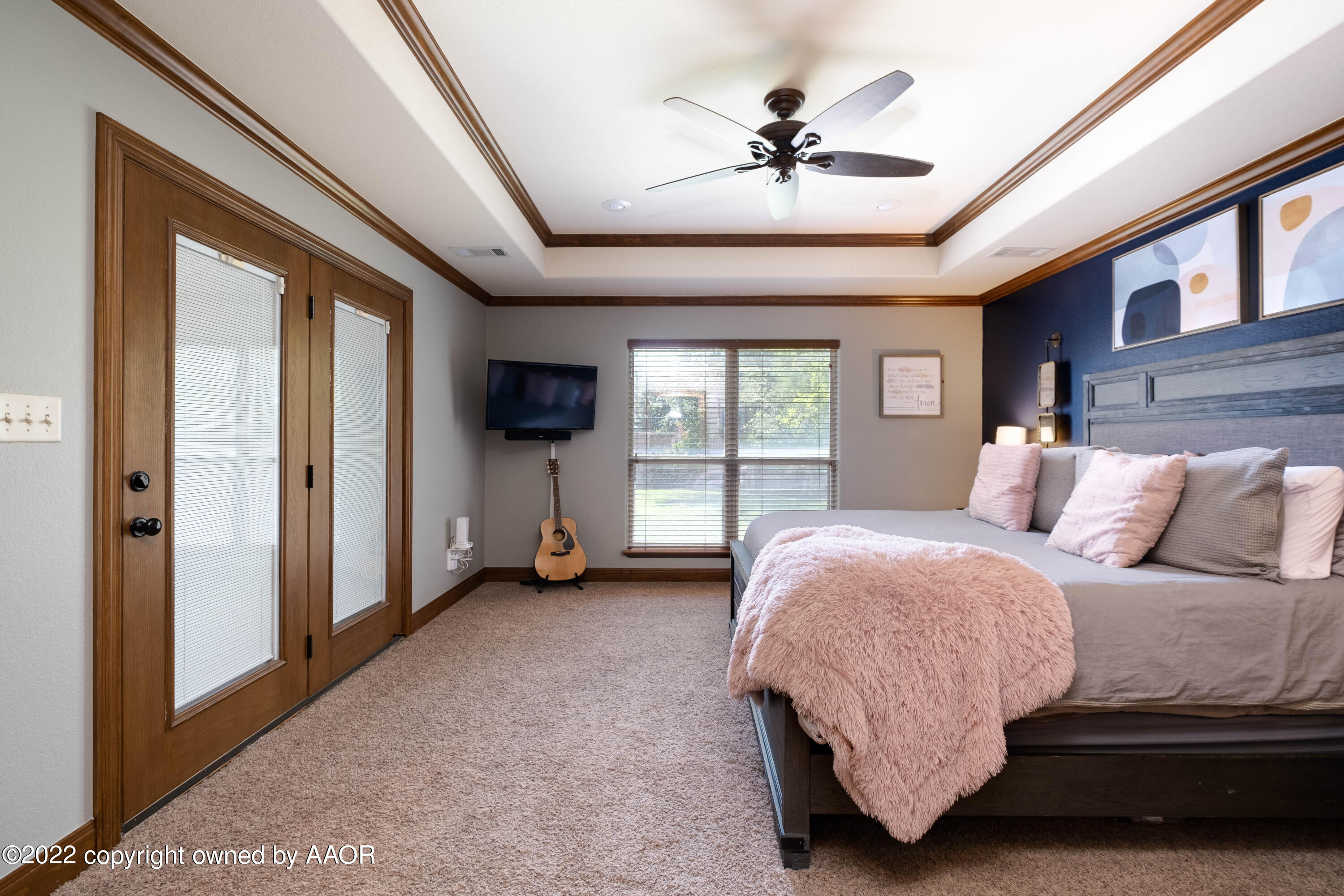 8417 Hamilton Drive Amarillo, TX 79119 - Photo 23 of 42 a spacious bedroom with a balcony a bed and a chandelier