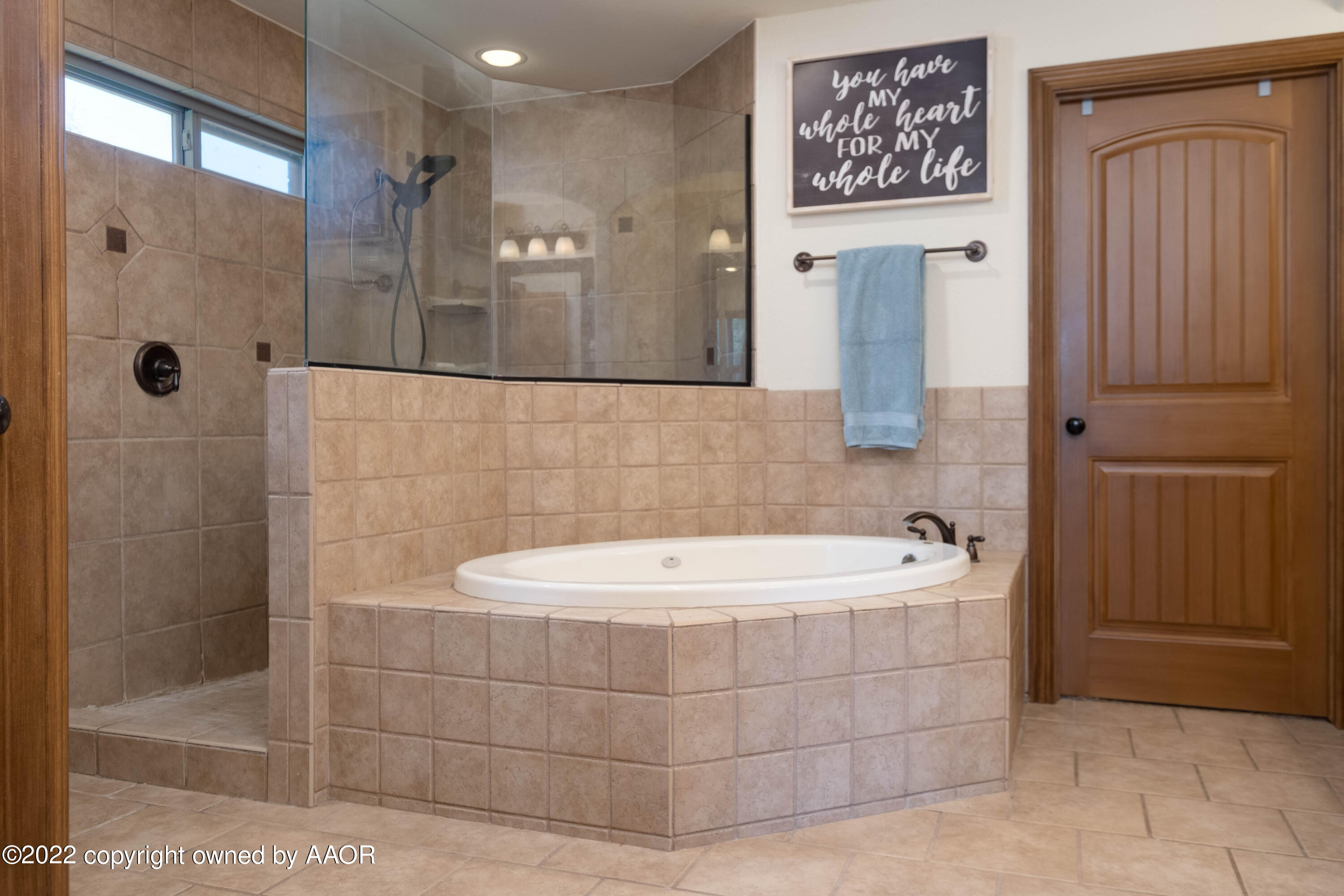 8417 Hamilton Drive Amarillo, TX 79119 - Photo 25 of 42 a bathroom with a bathtub and shower
