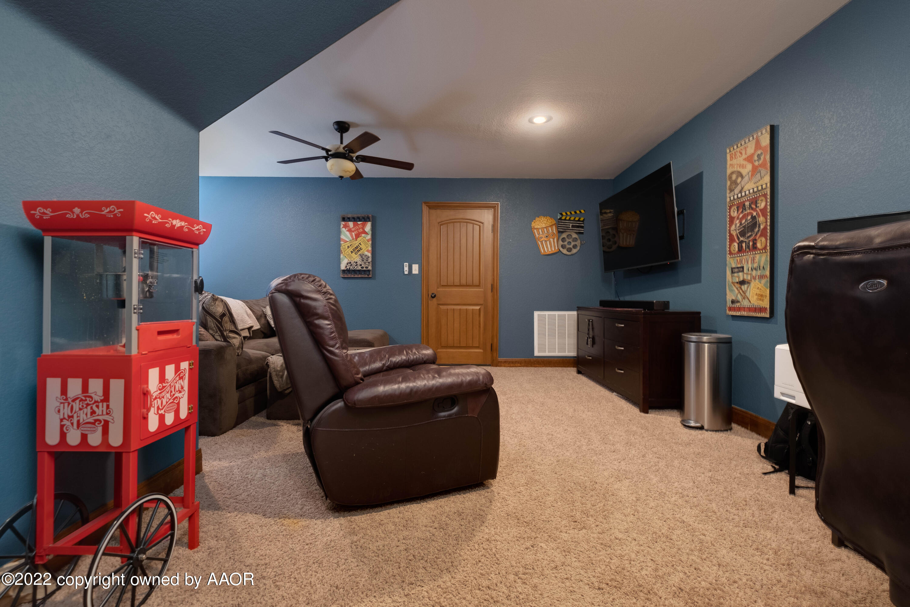 8417 Hamilton Drive Amarillo, TX 79119 - Photo 27 of 42 a living room with furniture a flat screen tv and kitchen view