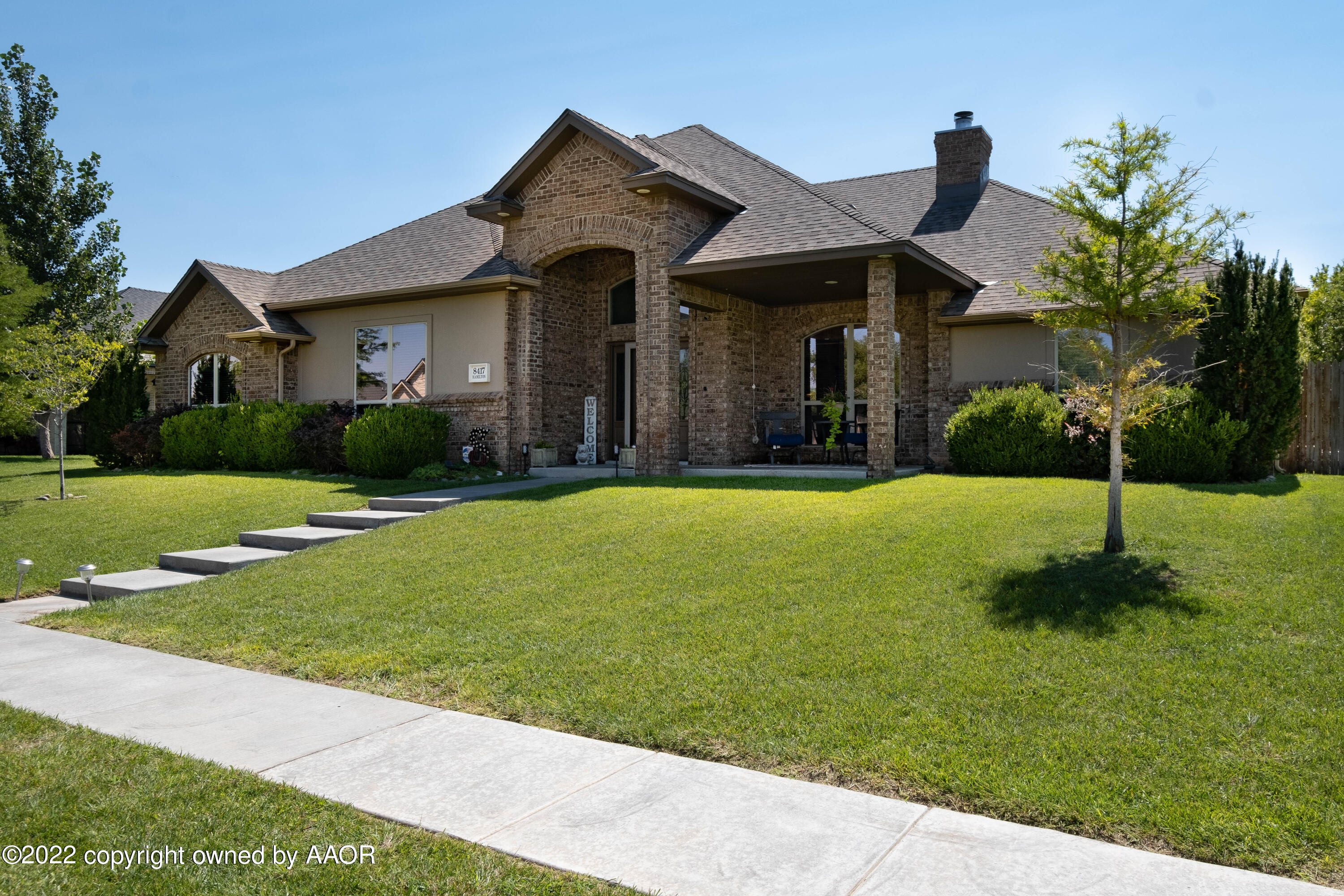 8417 Hamilton Drive Amarillo, TX 79119 - Photo 3 of 42 a front view of a house with a yard