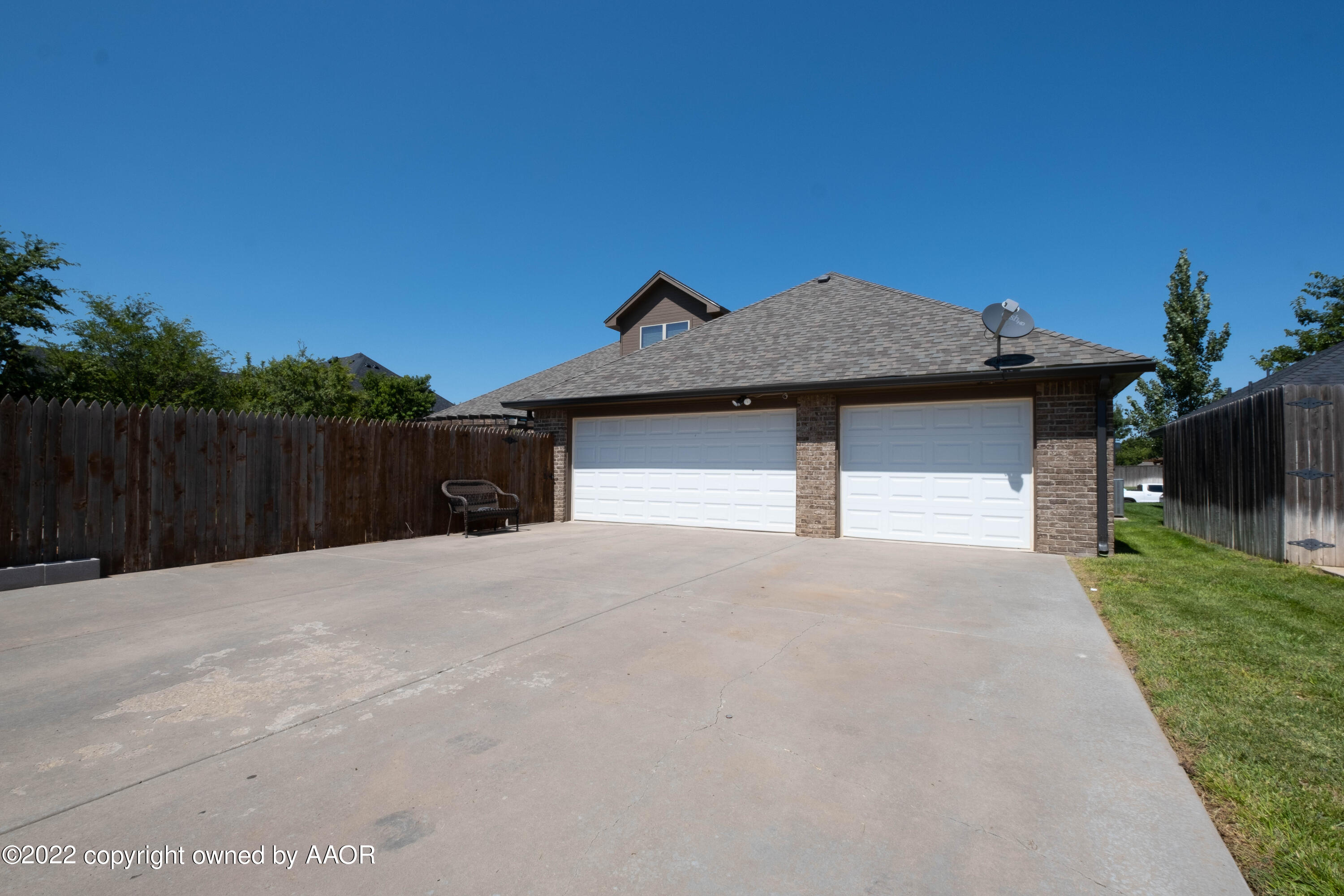 8417 Hamilton Drive Amarillo, TX 79119 - Photo 42 of 42 a front view of a house with a yard and garage