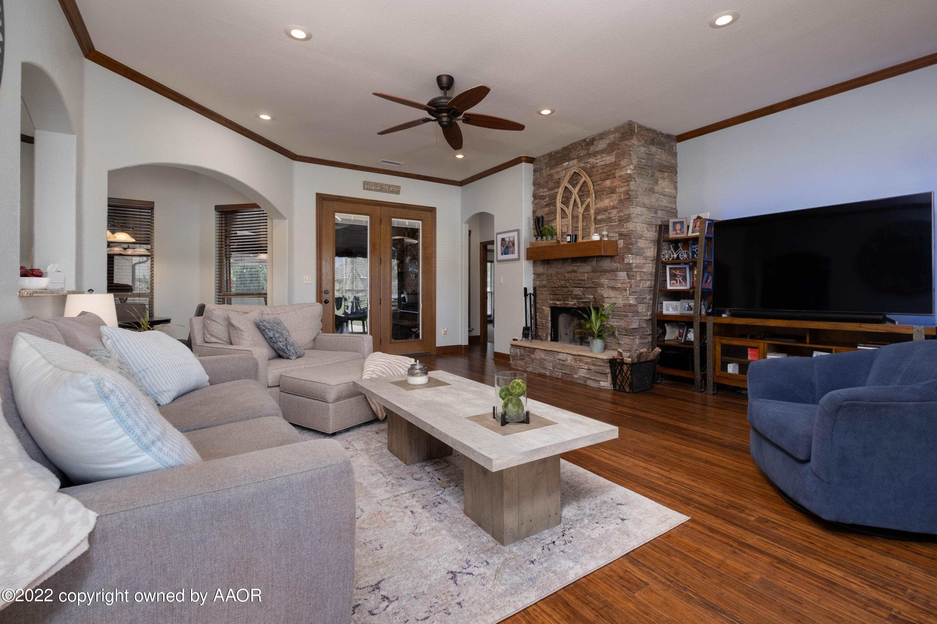 8417 Hamilton Drive Amarillo, TX 79119 - Photo 7 of 42 a living room with furniture and a flat screen tv