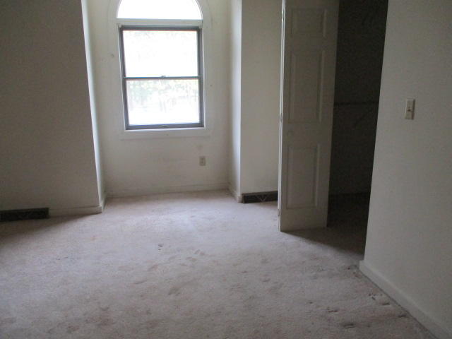 4 Shellback Way, Unit A Mashpee, MA 02649 - Photo 11 of 16 an empty room with windows