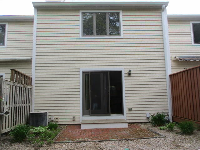 4 Shellback Way, Unit A Mashpee, MA 02649 - Photo 15 of 16 a view of a house with white door