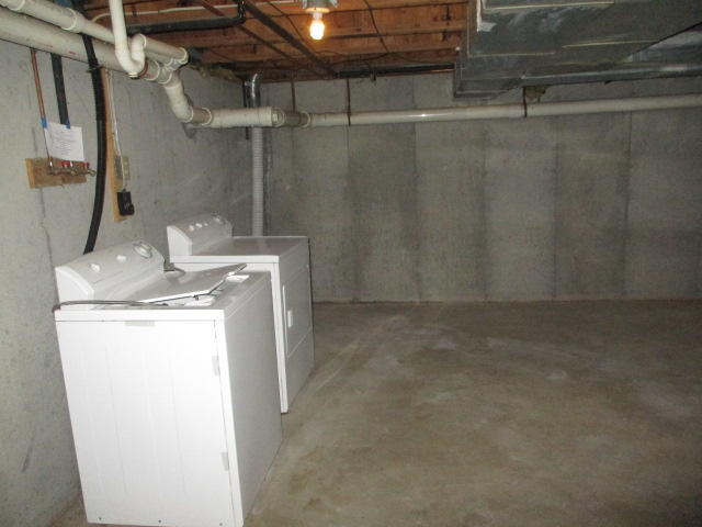 4 Shellback Way, Unit A Mashpee, MA 02649 - Photo 16 of 16 a utility room with dryer and washer