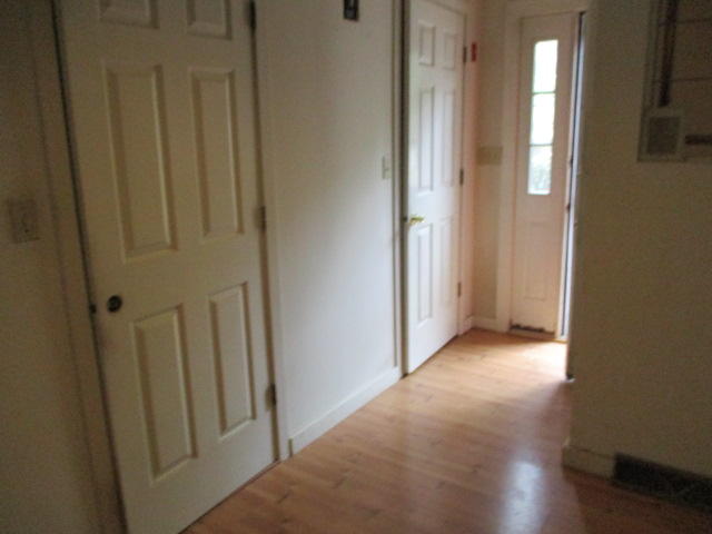 4 Shellback Way, Unit A Mashpee, MA 02649 - Photo 7 of 16 a view of a hallway with wooden floor