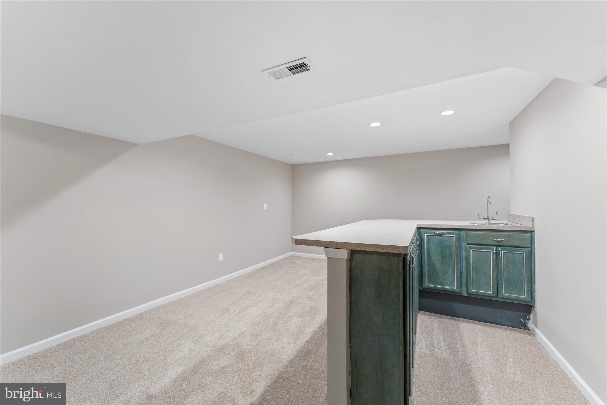 8047 Counselor Road Manassas, VA 20112 - Photo 38 of 55 Entertain with ease at the lower-level wet bar