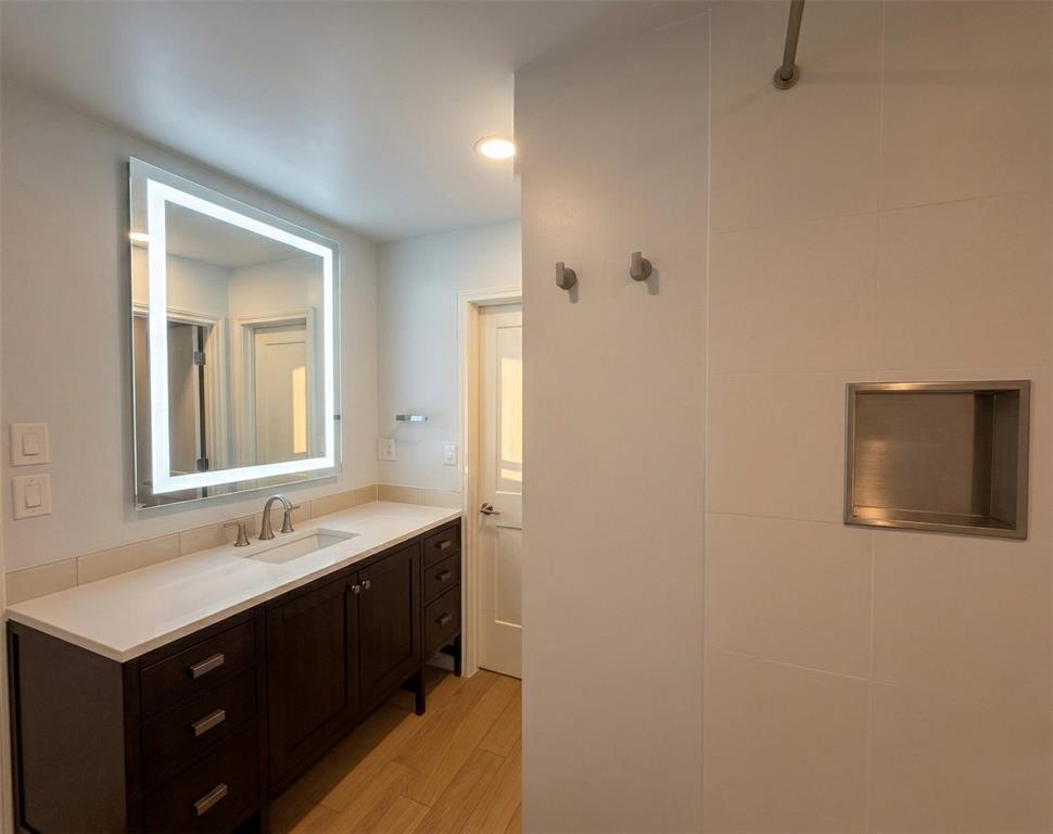 6524 Pheasant Run Road Plano, TX 75023 - Photo 34 of 40 TALL LIGHTED MIRROR & TALL CABINETS, DEEP SHOWER, TOWLET WARMER & SEPARATE CLOSET DOOR TOILET ROOM