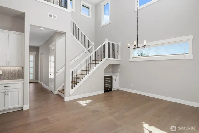 a view of entryway and hall with a front door