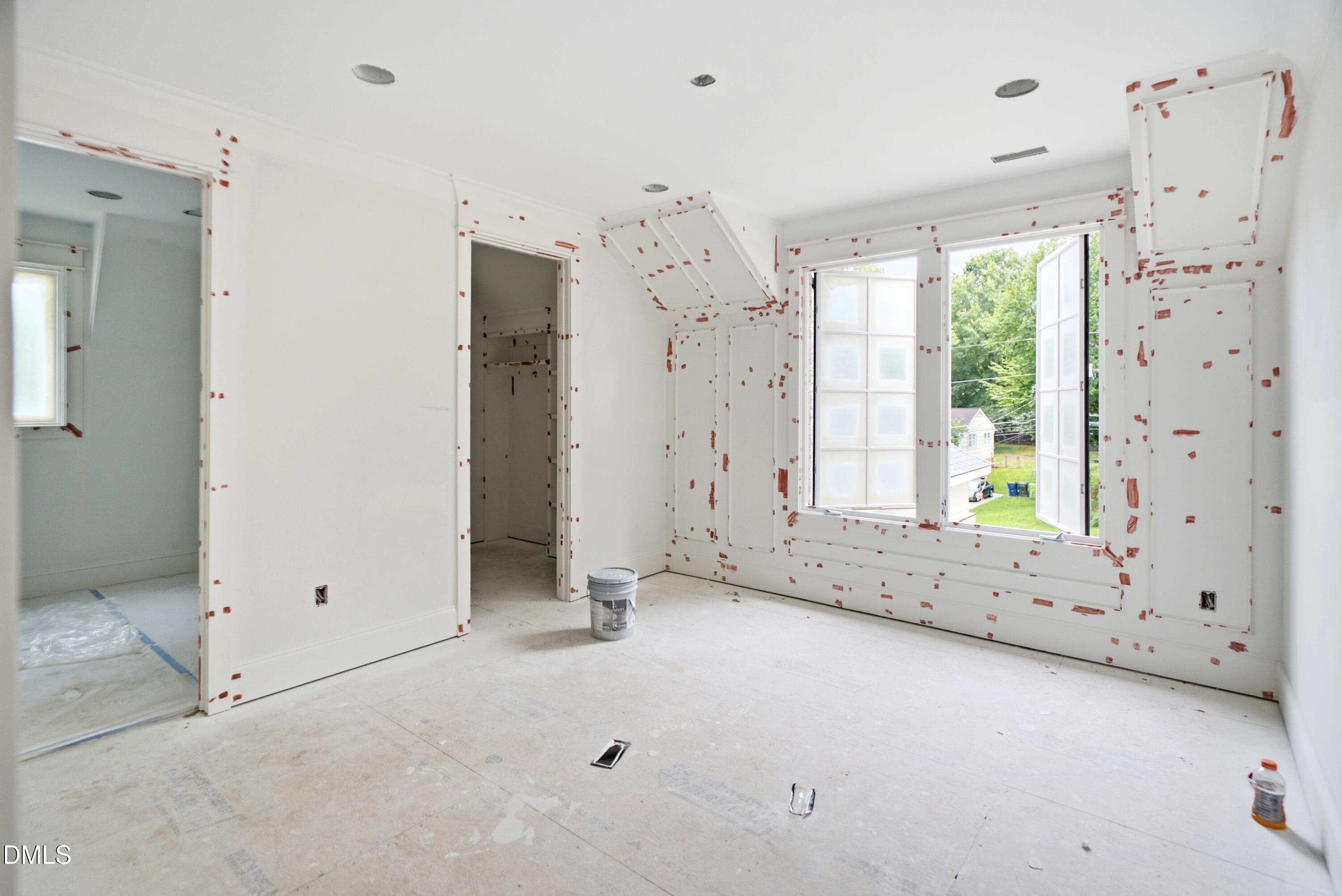 3438 Leonard Street Raleigh, NC 27607 - Photo 26 of 50 a view of a room with large windows and chandelier