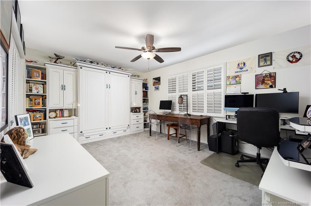 3100 Southeast Pruitt Road, Unit E204 Port St. Lucie, FL 34952 - Photo 16 of 40 a view of a livingroom with workspace and a window