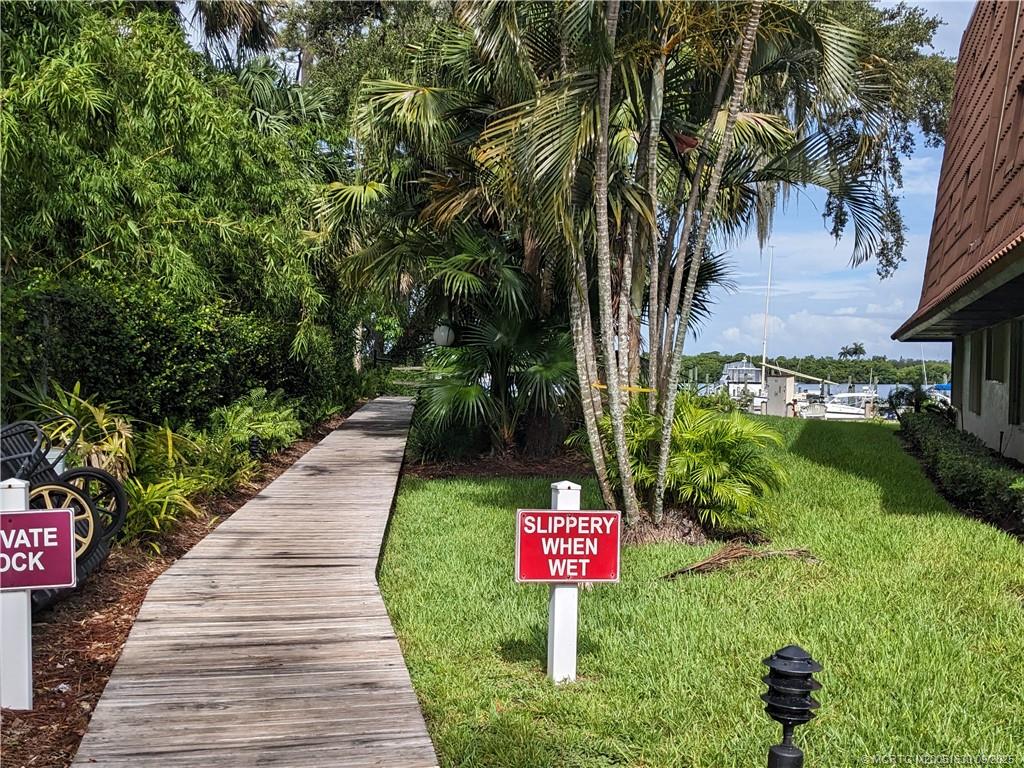 3100 Southeast Pruitt Road, Unit E204 Port St. Lucie, FL 34952 - Photo 22 of 40 a sign board with a yard