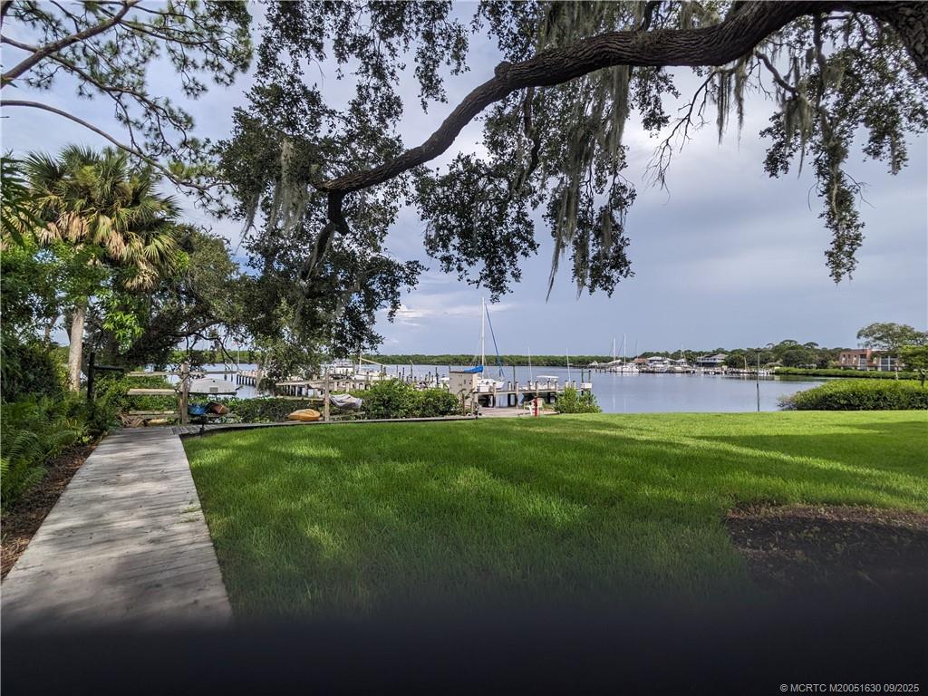 3100 Southeast Pruitt Road, Unit E204 Port St. Lucie, FL 34952 - Photo 23 of 40 a view of a park with large trees