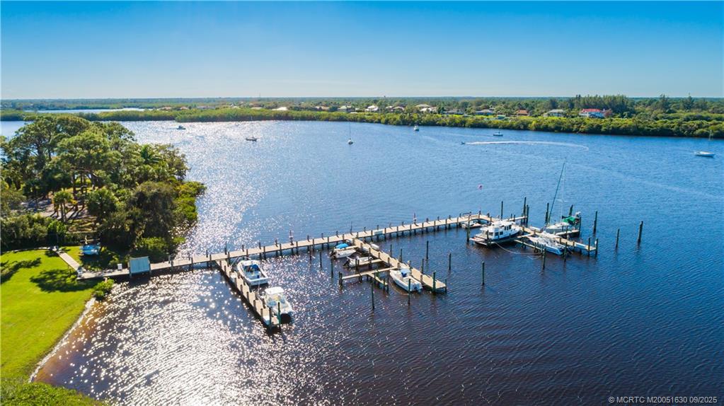 3100 Southeast Pruitt Road, Unit E204 Port St. Lucie, FL 34952 - Photo 26 of 40 an aerial view of a yard with lake view
