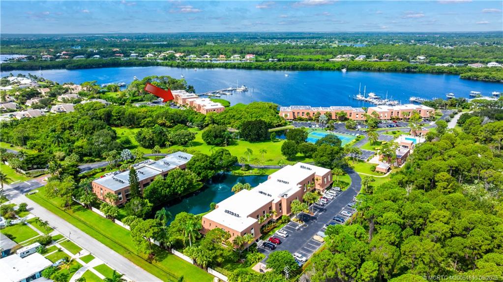 3100 Southeast Pruitt Road, Unit E204 Port St. Lucie, FL 34952 - Photo 28 of 40 a view of a lake with a city