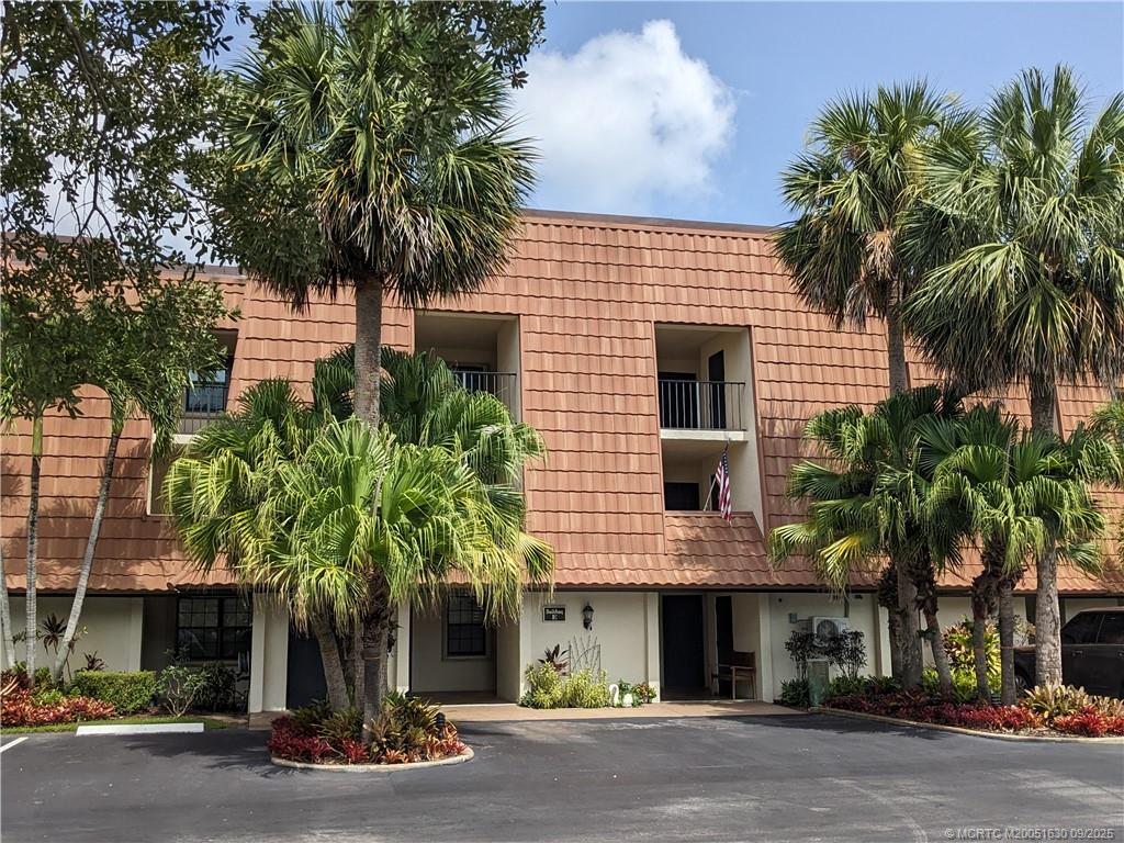 3100 Southeast Pruitt Road, Unit E204 Port St. Lucie, FL 34952 - Photo 40 of 40 a front view of a house with a tree