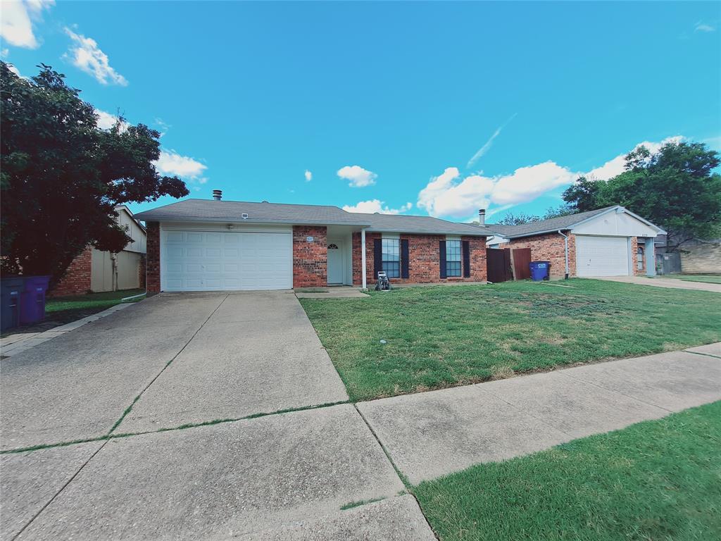 627 Valley View Drive Allen, TX 75002 - Photo 1 of 22 a front view of house with yard and green space