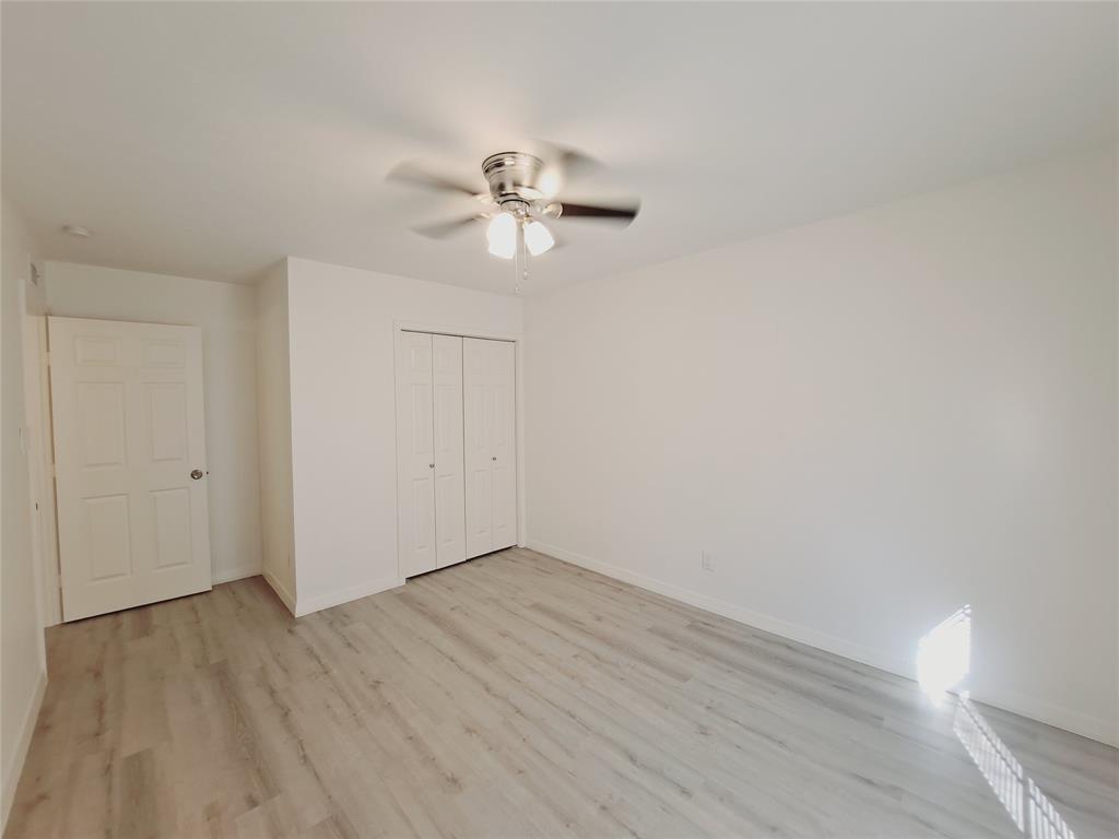 627 Valley View Drive Allen, TX 75002 - Photo 16 of 22 a view of a room with wooden floor and ceiling fan