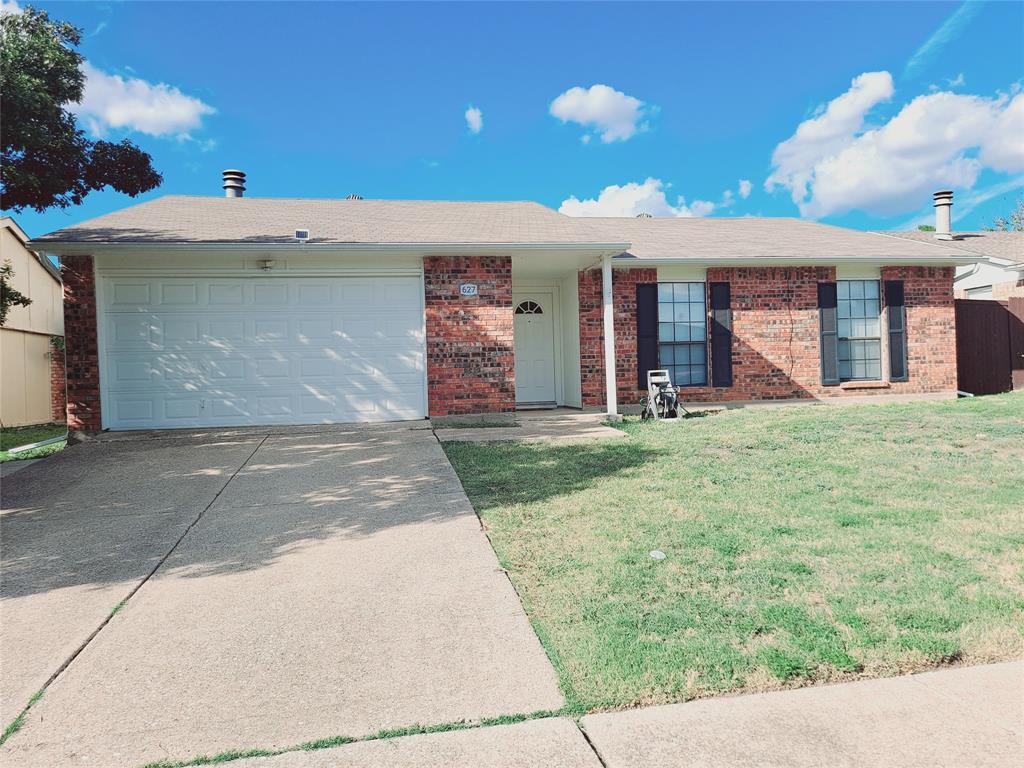 627 Valley View Drive Allen, TX 75002 - Photo 2 of 22 a front view of a house with a yard and garage