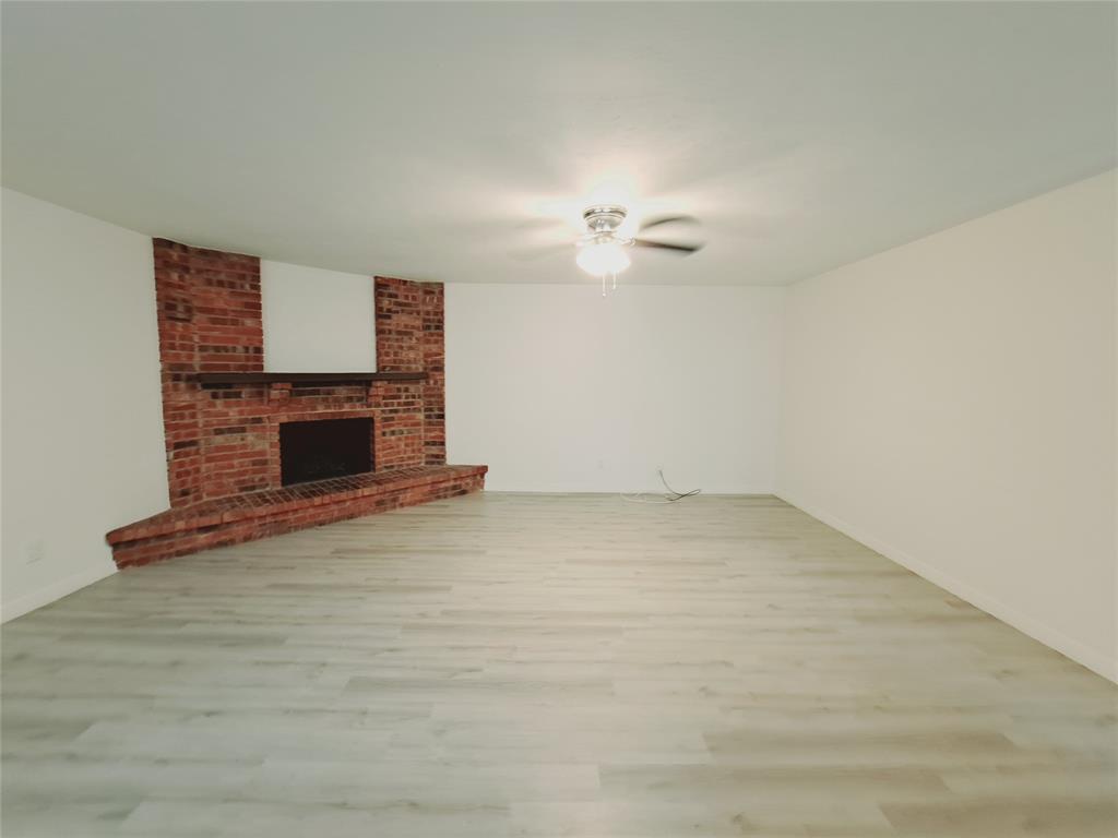 627 Valley View Drive Allen, TX 75002 - Photo 4 of 22 a view of empty room with fireplace