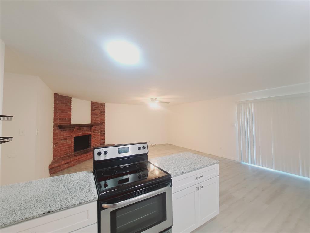 627 Valley View Drive Allen, TX 75002 - Photo 7 of 22 a kitchen with wooden cabinets and stainless steel appliances