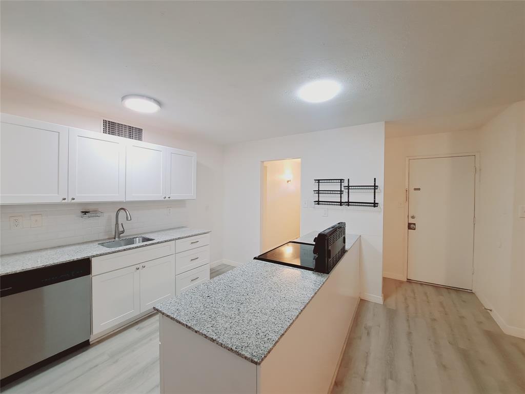 627 Valley View Drive Allen, TX 75002 - Photo 8 of 22 a kitchen with a sink dishwasher and cabinets