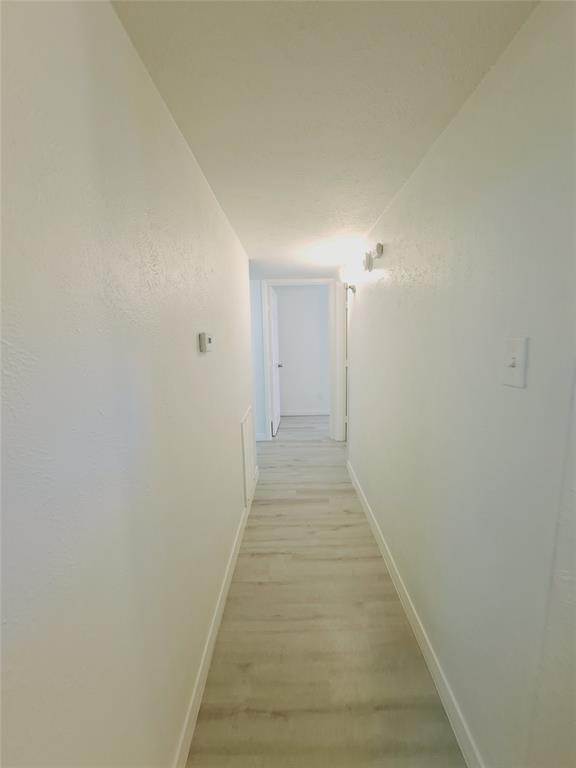 627 Valley View Drive Allen, TX 75002 - Photo 10 of 22 a view of a hallway with a white walls