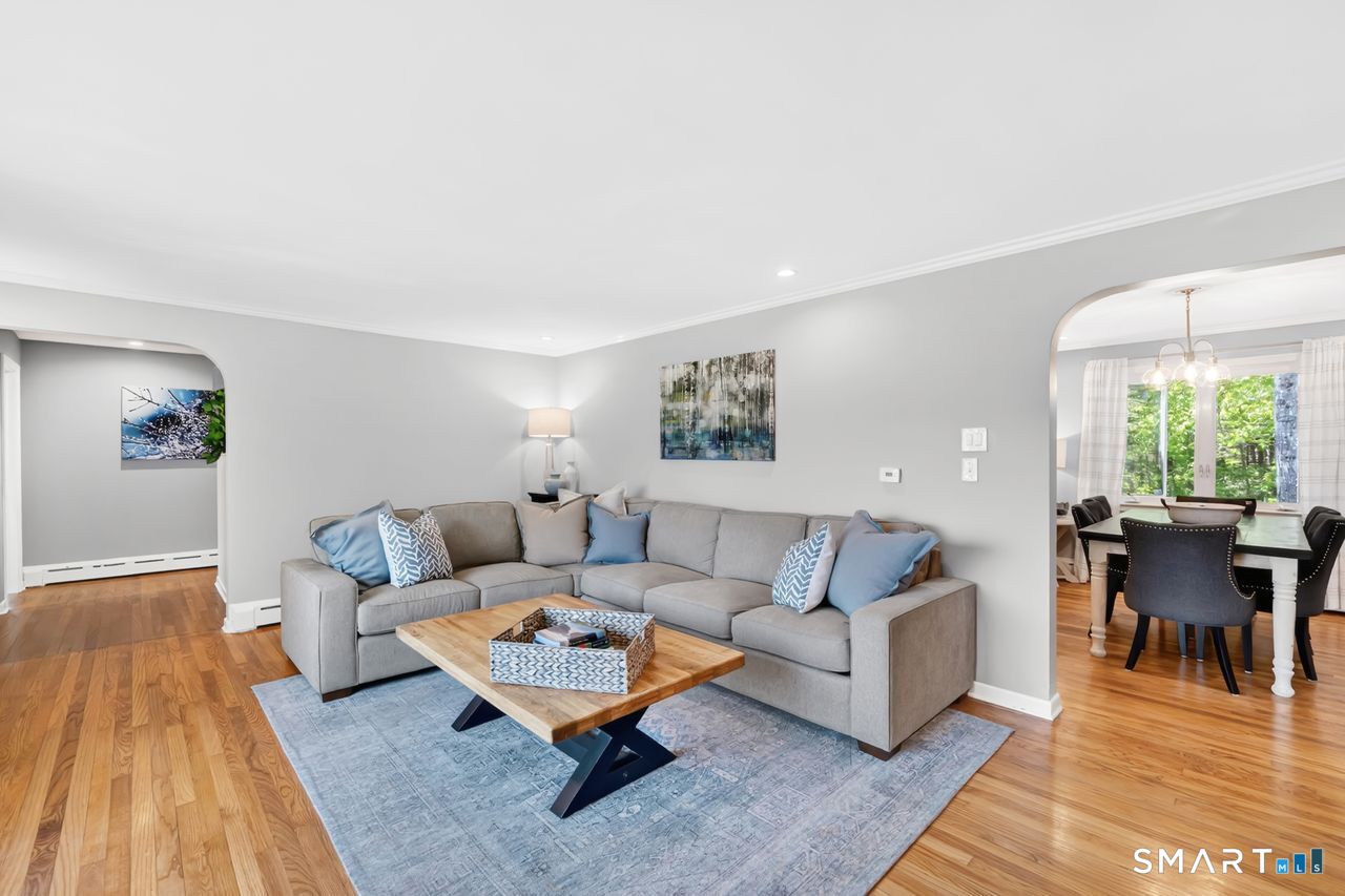 1013 Ratley Road Suffield, CT 06093 - Photo 10 of 39 a living room with furniture and a wooden floor