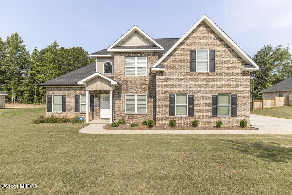 129 Timber Ridge Circle Byron, GA 31008 - Photo 1 of 42 a front view of a house with a yard