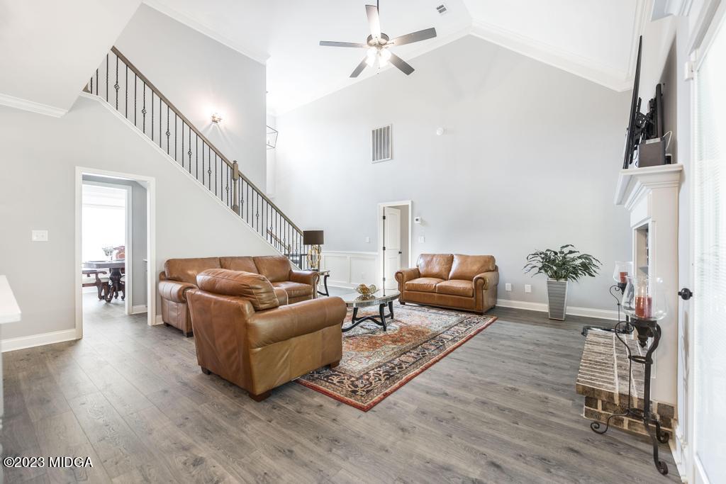 129 Timber Ridge Circle Byron, GA 31008 - Photo 12 of 42 a living room with furniture and a wooden floor