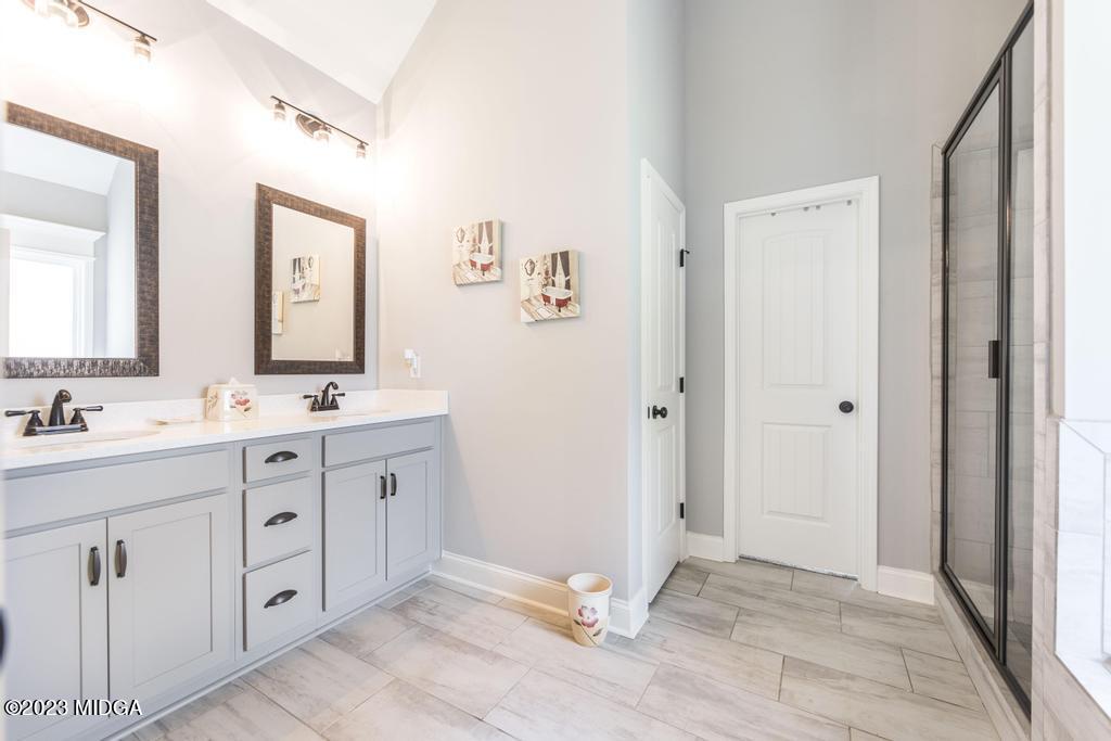 129 Timber Ridge Circle Byron, GA 31008 - Photo 25 of 42 a bathroom with a double vanity sink and mirror