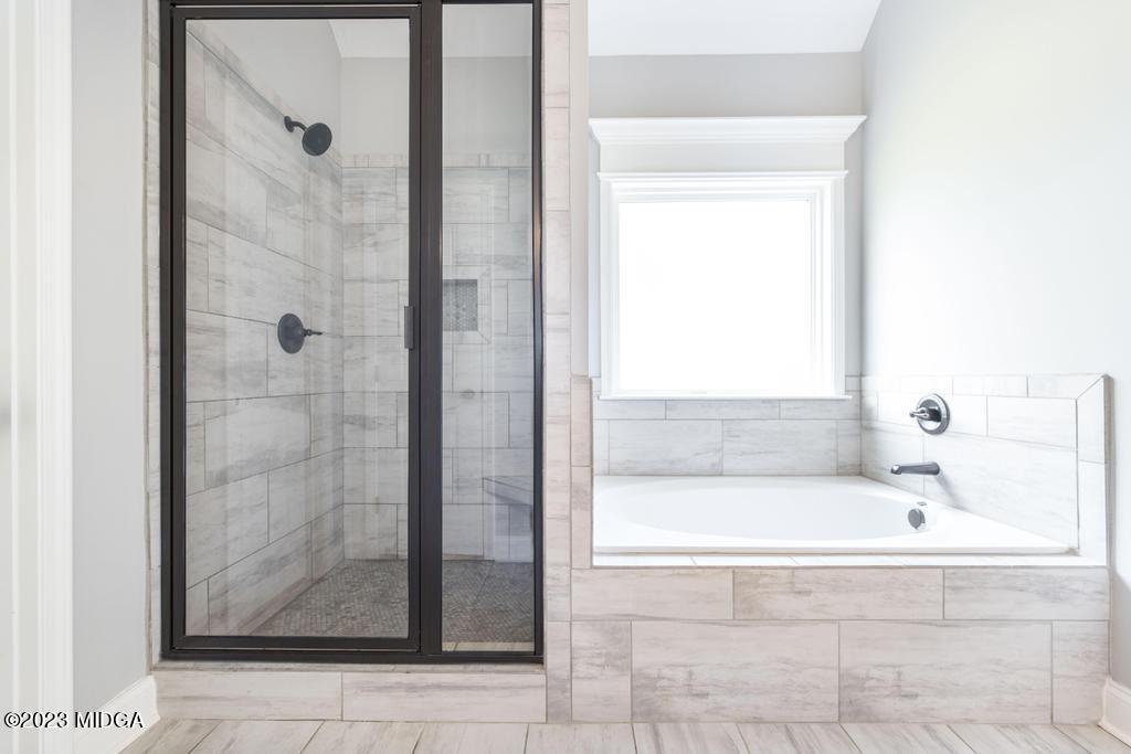 129 Timber Ridge Circle Byron, GA 31008 - Photo 26 of 42 a bathroom with a bathtub and shower