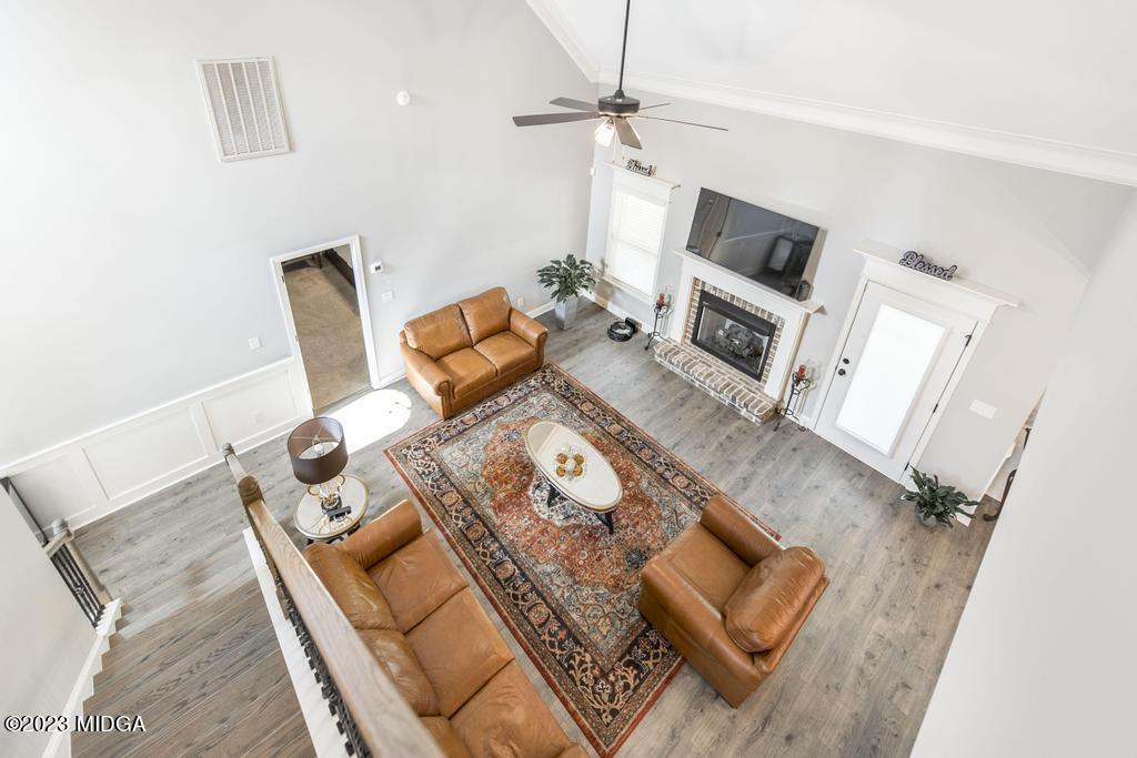 129 Timber Ridge Circle Byron, GA 31008 - Photo 29 of 42 a living room with furniture and a flat screen tv
