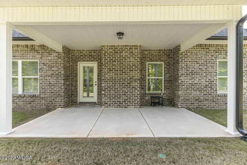 129 Timber Ridge Circle Byron, GA 31008 - Photo 38 of 42 a view of a brick house with large windows